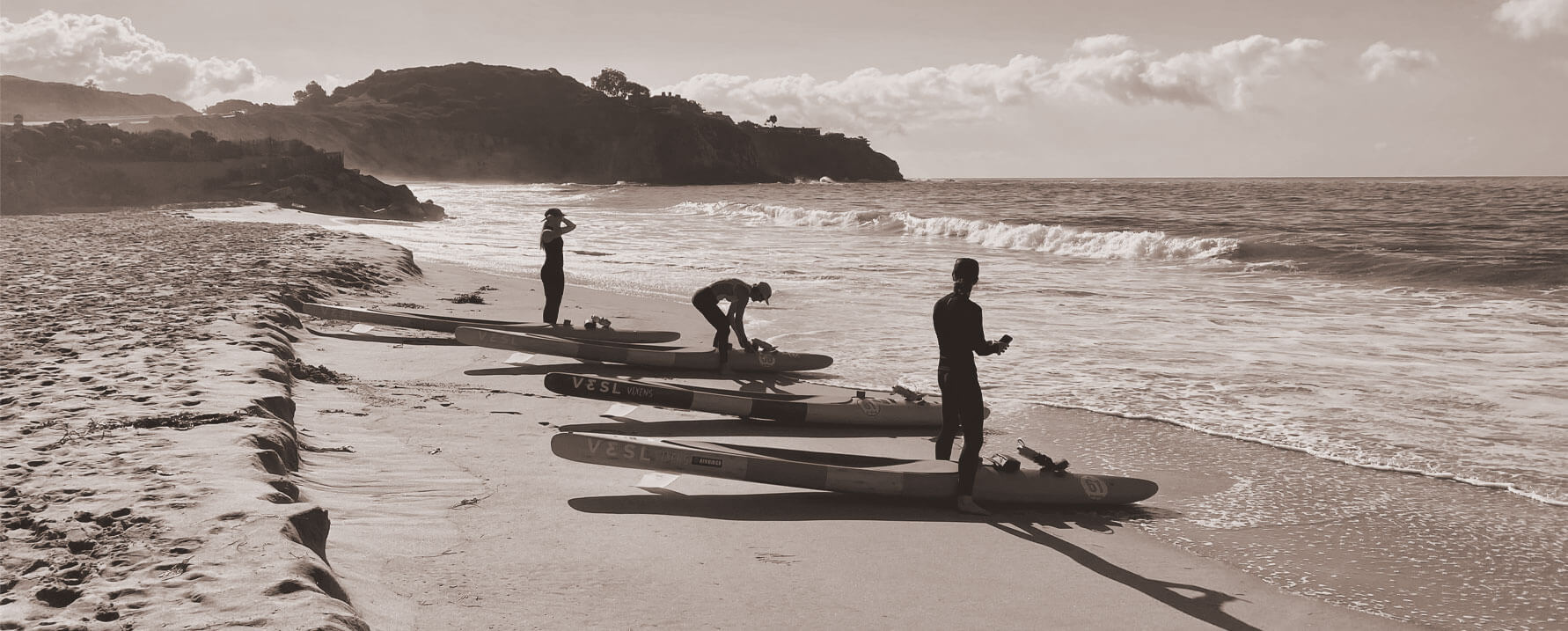 women prone paddleboard paddling